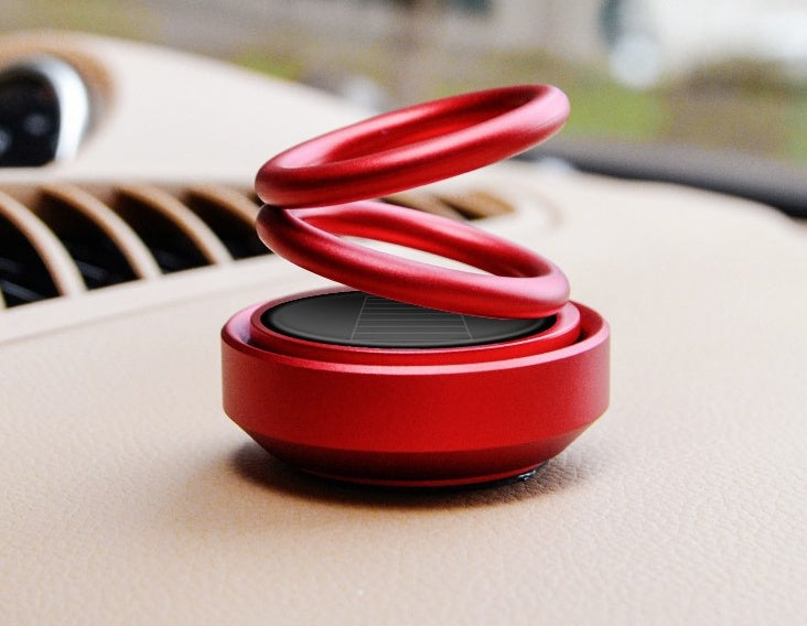 Ambientador solar para coche con rotación automática y aromatizante para asiento.